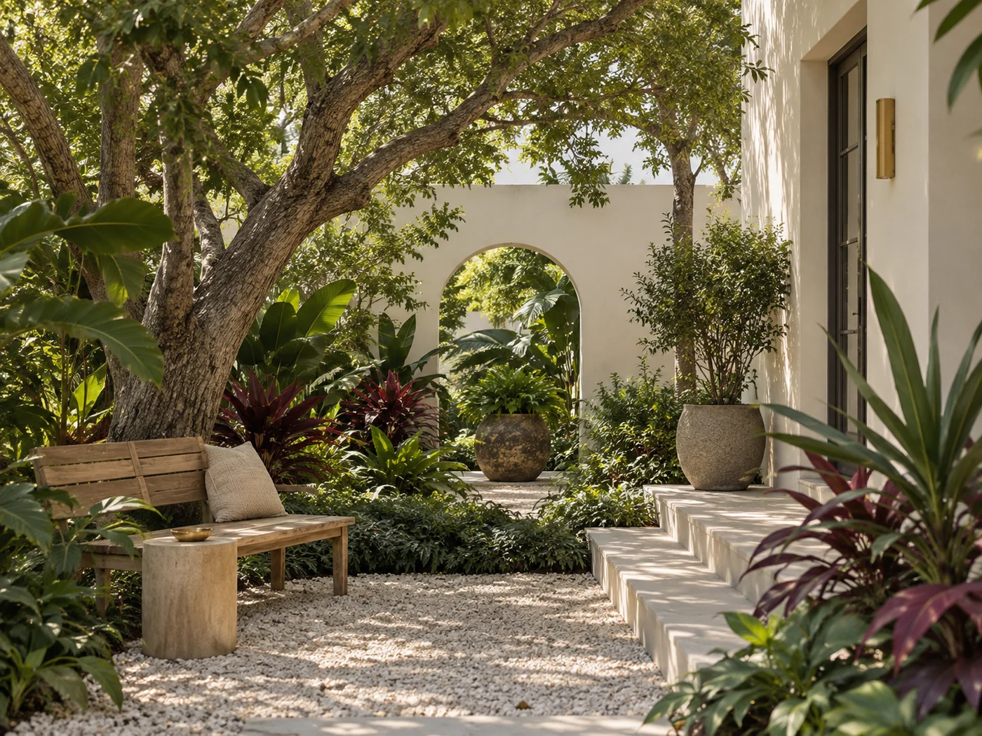 A sunlit subtropical courtyard with a wooden bench
